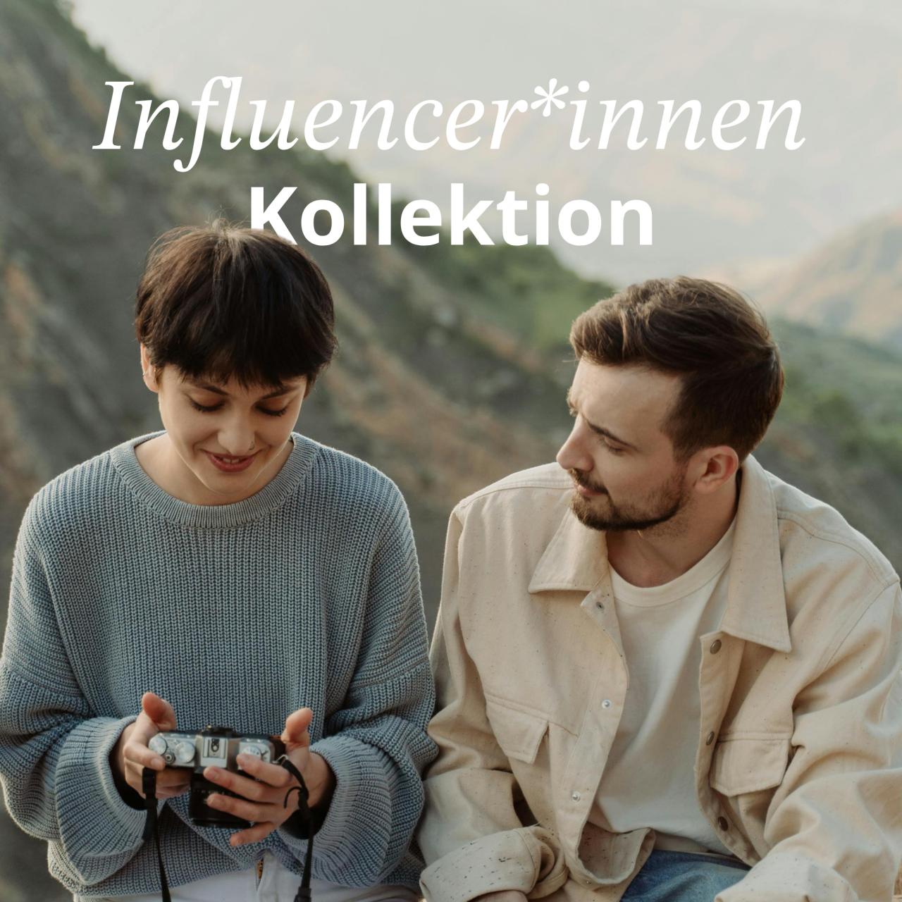 Frau und Mann mit Kamera in der Natur